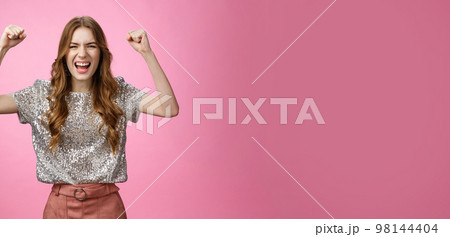 Cheerful supportive good-looking glamour woman acting daring sassy raise clenched fists yelling make bet hope team win shouting encouraging words standing hopeful wanna win see victory 98144404
