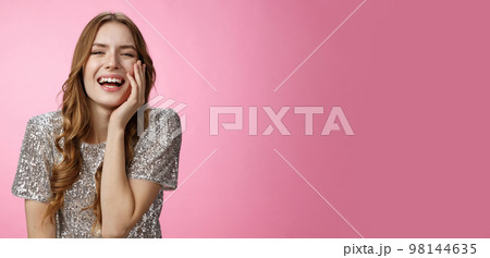 Haha so funny. Flirty coquettish attractive caucasian female laughing touching face feminine seduction gesture giggling showing interest talking amused, having fun enjoy cool party, pink background Haha so funny. Flirty coquettish attractive caucasian female laughing touching face feminine seduction gesture giggling showing interest talking amused, having fun enjoy cool party, pink background 98144635
