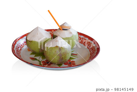 three coconuts placed on white and red tray, on white background, nature, food, copy space three coconuts placed on white and red tray, on white background, nature, food, copy space 98145149