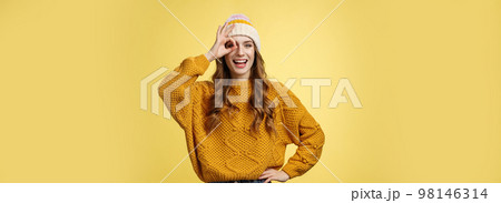 Smiling optimistic happy charming girl show okay ok gesture assuring everthing alright keep up supporting you, like awesome idea excited try out, standing satisfied yellow background 98146314