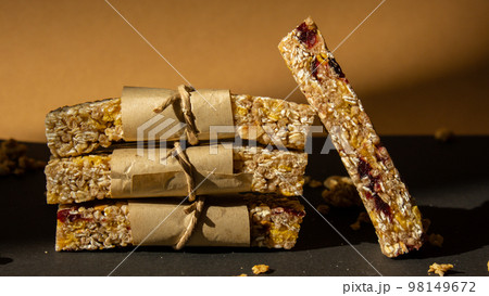 Homemade Granola energy bar. Variety of homemade protein granola breakfast bars with nuts, raisins dried cherries and chocolate. Healthy nutrition eating Gluten free cereal dieting snack super food Homemade Granola energy bar. Variety of homemade protein granola breakfast bars with nuts, raisins dried cherries and chocolate. Healthy nutrition eating Gluten free cereal dieting snack super food 98149672