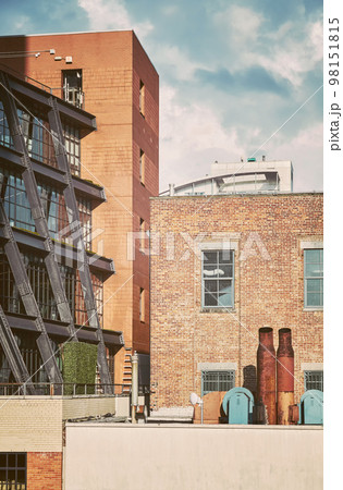 Urban scene with rusty exhaust pipes, color toning applied, New York City, USA. 98151815