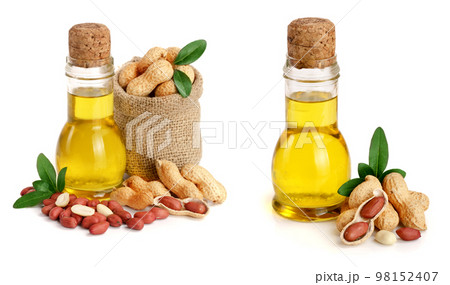peanut oil in a glass bottle with peanuts in bag 98152407