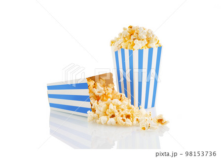 Two blue white striped carton buckets with tasty cheese popcorn, isolated on white background Two blue white striped carton buckets with tasty cheese popcorn, isolated on white background 98153736