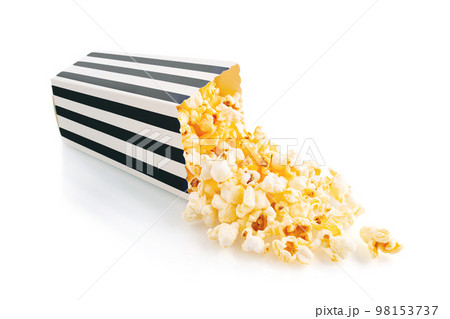 Tasty cheese popcorn falling out of a black striped carton bucket, isolated on white background Tasty cheese popcorn falling out of a black striped carton bucket, isolated on white background 98153737