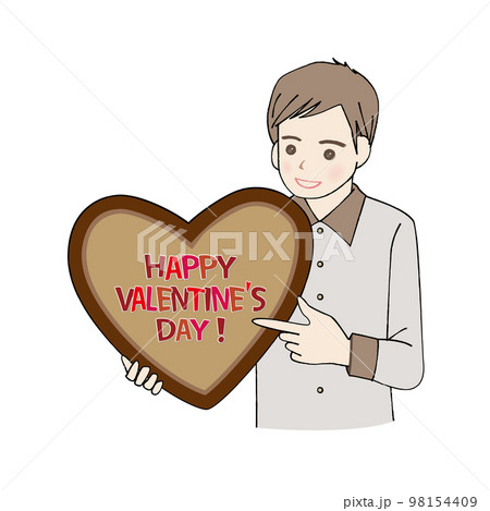 ハートのチョコレートを持って指さす男性   98154409