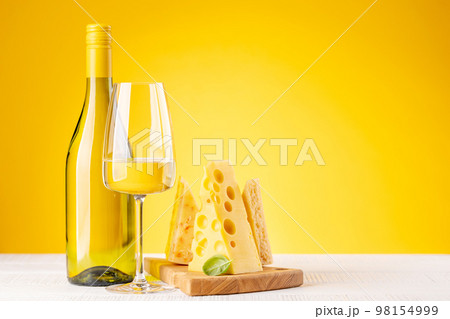 Various cheese on board and white wine Various cheese on board and white wine 98154999