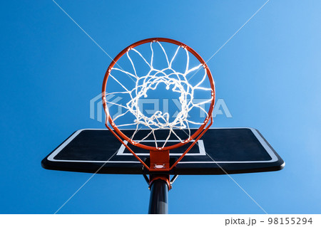 Basketball and blue sky background Basketball and blue sky background 98155294