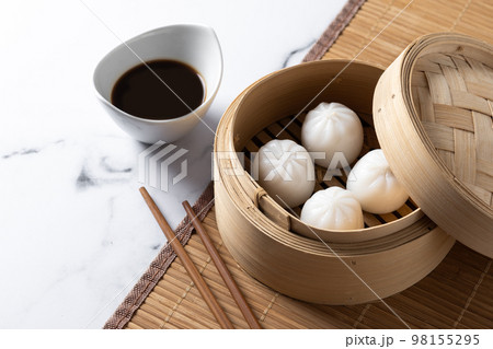 Steamed dumplings on white marble background. Traditional oriental food Steamed dumplings on white marble background. Traditional oriental food 98155295