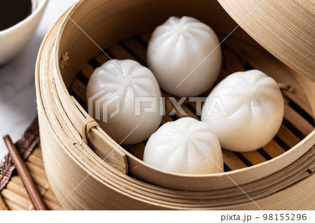 Steamed dumplings on white marble background. Traditional oriental food Steamed dumplings on white marble background. Traditional oriental food 98155296