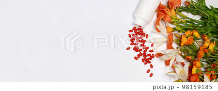 Banner with bioadditive tablets and medicinal plants with place for text copy space. Lutein, herbal medicine pills Banner with bioadditive tablets and medicinal plants with place for text copy space. Lutein, herbal medicine pills 98159185