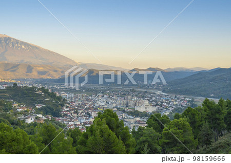 View to Berat, historic city in the south of Albania at night with all lights flashing and white houses gathering on a hill. Captured during blue hour with the sky full of stars. 98159666