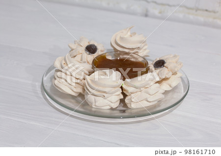 Homemade zephyr. Apricot jam. On a white background. Close-up. Homemade zephyr. Apricot jam. On a white background. Close-up. 98161710