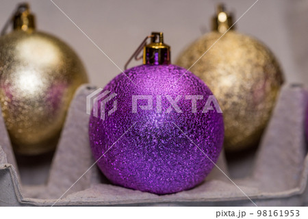 Christmas tree glitter balls in egg carton box. Easter and New Year concept Christmas tree glitter balls in egg carton box. Easter and New Year concept 98161953