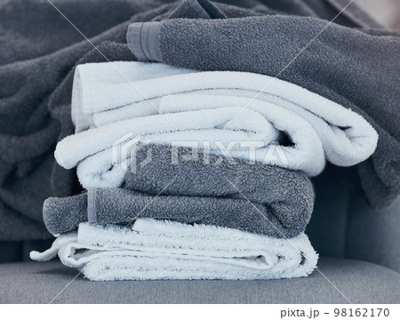 Towels, clean and laundry with texture and fabric for cleaning and hygiene in hospitality or home. Fresh washing, cleaning service or household maintenance closeup with cotton towel and textures. Towels, clean and laundry with texture and fabric for cleaning and hygiene in hospitality or home. Fresh washing, cleaning service or household maintenance closeup with cotton towel and textures. 98162170