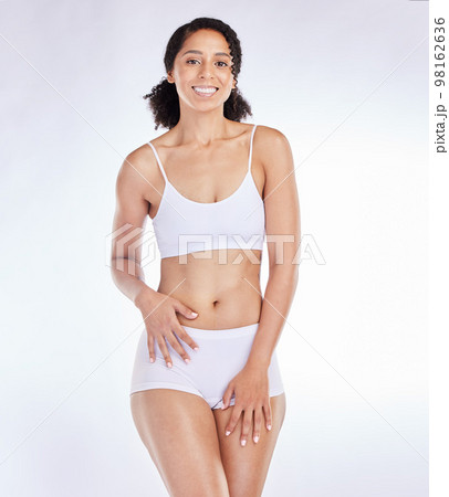 Portrait of black woman, beauty and skincare fitness health model for healthy cosmetics, natural body and woman on white studio background in underwear. Happy smile, self care and self love wellness Portrait of black woman, beauty and skincare fitness health model for healthy cosmetics, natural body and woman on white studio background in underwear. Happy smile, self care and self love wellness 98162636