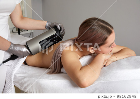 Endosphere therapy of female body by cosmetologist in beauty salon 98162948