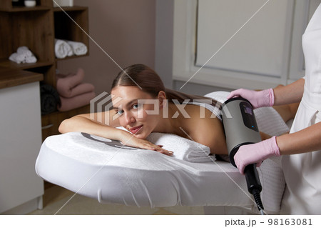 Endosphere therapy of female body by cosmetologist in beauty salon 98163081