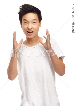 Cool and casual. A cropped portrait of a surprised looking young teen isolated on white. Cool and casual. A cropped portrait of a surprised looking young teen isolated on white. 98163807