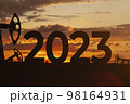 Oil production against backdrop of beautiful sunset. 2023 and oil fields.  98164931