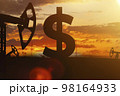 Sing ruble and oil sign against backdrop of beautiful sunset.  98164933