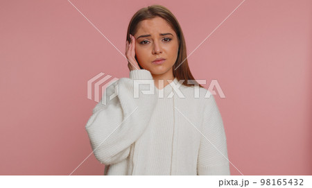 Woman rubbing temples to cure headache problem, suffering from tension and migaine, stress, pain Woman rubbing temples to cure headache problem, suffering from tension and migaine, stress, pain 98165432