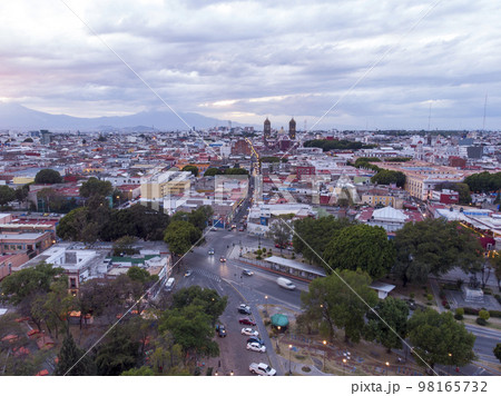 Puebla at Dramatic evening Sunset aerial drone shot of City Center in Puebla de Zaragoza, Puebla State, Mexico Puebla at Dramatic evening Sunset aerial drone shot of City Center in Puebla de Zaragoza, Puebla State, Mexico 98165732