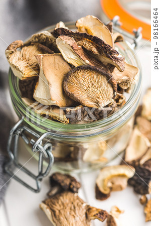 Sliced dried mushrooms in jar. 98166464