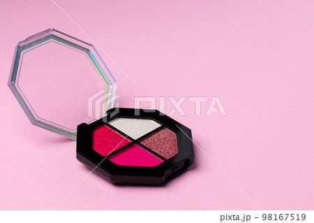 Set of eyeshadows make up products on pink Set of eyeshadows make up products on pink 98167519