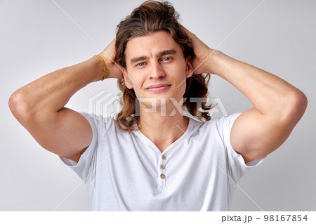Close-up portrait of attractive young man model with muscular body and stylish haircut Close-up portrait of attractive young man model with muscular body and stylish haircut 98167854