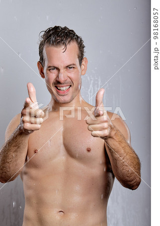 shirtless man with perfect skin showing at you, look at camera, having sexy muscular body shirtless man with perfect skin showing at you, look at camera, having sexy muscular body 98168057