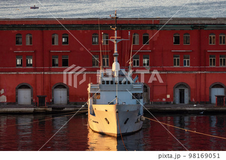 Navy Warship at a port with Historic Downtown City on Mediterranean Coast of Naples, Italy.  98169051