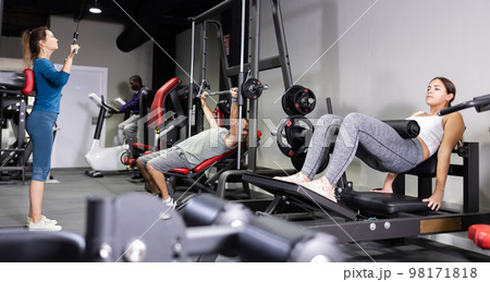 Athletic sporty woman doing press at sport gym Athletic sporty woman doing press at sport gym 98171818