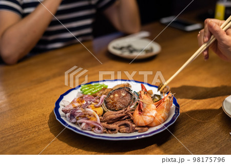 eat plate of seafood on table eat plate of seafood on table 98175796
