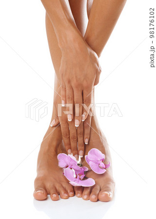Beauty, hands and feet with orchid and woman in manicure and pedicure zoom, skincare with glow against white background. Nails, flower aesthetic with cosmetic care and wellness with nature cosmetics Beauty, hands and feet with orchid and woman in manicure and pedicure zoom, skincare with glow against white background. Nails, flower aesthetic with cosmetic care and wellness with nature cosmetics 98176102