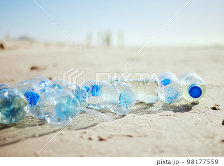 Plastic bottles, beach sand or litter in recycling volunteering, global warming sustainability or earth community service. Zoom, trash texture or ocean waste management in environment nature cleaning Plastic bottles, beach sand or litter in recycling volunteering, global warming sustainability or earth community service. Zoom, trash texture or ocean waste management in environment nature cleaning 98177559
