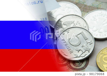 Stacks of coins on the background of the flag of Russia. 98179068