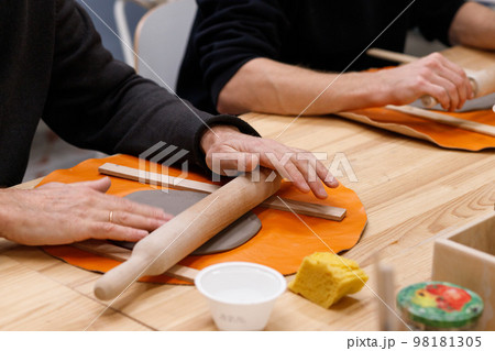 Male hands close-up. Master class clay modeling. Creative classes for adults and the elderly. Male hands close-up. Master class clay modeling. Creative classes for adults and the elderly. 98181305