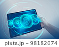Bitcoin, Ethereum, Cardano, Dogecoin, Binance Coin symbol hologram on tablet screen. Cryptocurrency and future technology concept. 98182674