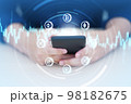 Hand using smart phone with Cryptocurrency coin symbol. Cryptocurrency and future technology. 98182675