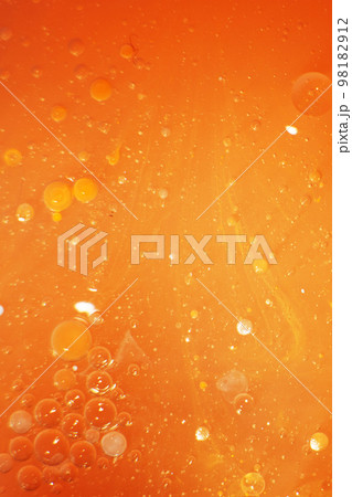 Gold Oil bubbles close up. circles of orange water macro. abstract shiny yellow background Gold Oil bubbles close up. circles of orange water macro. abstract shiny yellow background 98182912