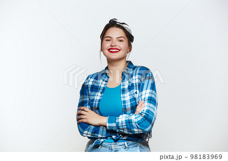 Plus Size Woman Smiling Isolated. Portrait of Bossy Woman Looking at Camera Plus Size Woman Smiling Isolated. Portrait of Bossy Woman Looking at Camera 98183969