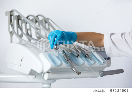 Different dental instruments and tools in a dentists office Different dental instruments and tools in a dentists office 98184601