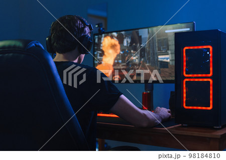 professional gamer playing tournaments online video games on computer 98184810