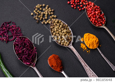 Several types of spices in metal spoons paprika, tomatoes, curry, beets, cumin, turmeric, fennel, spirulina Several types of spices in metal spoons paprika, tomatoes, curry, beets, cumin, turmeric, fennel, spirulina 98185648