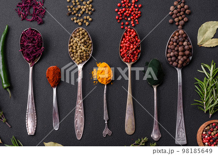 Several types of spices in metal spoons paprika, tomatoes, curry, beets, cumin, turmeric, fennel, spirulina Several types of spices in metal spoons paprika, tomatoes, curry, beets, cumin, turmeric, fennel, spirulina 98185649