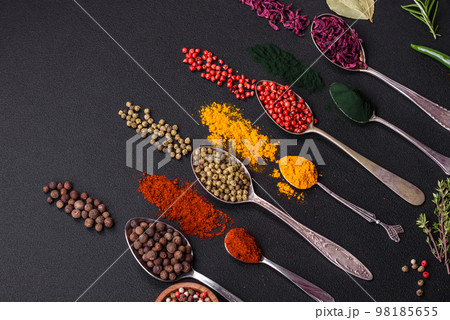Several types of spices in metal spoons paprika, tomatoes, curry, beets, cumin, turmeric, fennel, spirulina Several types of spices in metal spoons paprika, tomatoes, curry, beets, cumin, turmeric, fennel, spirulina 98185655