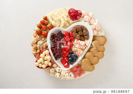 Charcuterie Valentines Day board with chocolate sweets. Charcuterie Valentines Day board with chocolate sweets. 98188697
