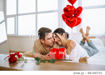 Valentine's Day concept. Happy couple in love with. Young loving couple celebrating Valentine's Day Valentine's Day concept. Happy couple in love with. Young loving couple celebrating Valentine's Day 98188701