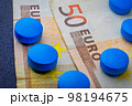 Herbal drug set of blue pill on 50 euro banknote macro 98194675